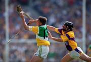 18 June 2000; Michael Duignan of Offaly in action against Sean Flood of Wexford during the Guinness Leinster Senior Hurling Championship Semi-Final match between Offaly and Wexford at Croke Park in Dublin. Photo by Ray McManus/Sportsfile