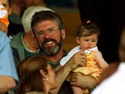 18 June 2000; Sinn Fein President Gerry Adams with his grandaughter Drithle during the Bank of Ireland Ulster Senior Football Championship Semi-Final match between Antrim and Derry at Casement Park in Derry. Photo by David Maher/Sportsfile