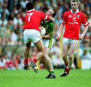 18 June 2000; John Crowley of Kerry is tackled by Martin Cronin of Cork during the Bank of Ireland Munster Senior Football Championship Semi-Final match between Kerry and Cork at Fitzgerald Stadium in Killarney, Kerry. Photo by Brendan Moran/Sportsfile
