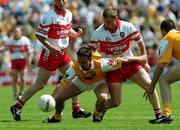 18 June 2000; Aidan Morris of Antrim in action Niall McCusker of Derry during the Bank of Ireland Ulster Senior Football Championship Semi-Final match between Antrim and Derry at Casement Park in Derry. Photo by David Maher/Sportsfile