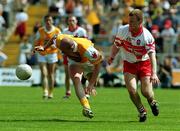 18 June 2000; Anto Finnegan of Antrim in action against Niall McCusker of Derry during the Bank of Ireland Ulster Senior Football Championship Semi-Final match between Antrim and Derry at Casement Park in Derry. Photo by David Maher/Sportsfile