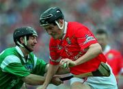4 June 2000; John Browne of Cork in action against Mike Galligan of Limerick during the Guinness Munster Senior Hurling Championship Semi-Final match between Cork and Limerick at Semple Stadium in Thurles, Tipperary. Photo by Ray McManus/Sportsfile