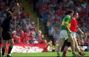 18 June 2000; Cork's Philip Clifford is shown a yellow card by referee Mick Curley during the Bank of Ireland Munster Senior Football Championship Semi-Final match between Kerry and Cork at Fitzgerald Stadium in Killarney, Kerry. Photo by Brendan Moran/Sportsfile