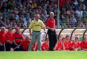 18 June 2000;  Cork manager Larry Tompkins, right, and Kerry manager Páidí Ó Sé during the Bank of Ireland Munster Senior Football Championship Semi-Final match between Kerry and Cork at Fitzgerald Stadium in Killarney, Kerry. Photo by Brendan Moran/Sportsfile