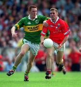 18 June 2000; Kieran Daly of Cork in action against Noel Kennelly of Kerry during the Bank of Ireland Munster Senior Football Championship Semi-Final match between Kerry and Cork at Fitzgerald Stadium in Killarney, Kerry. Photo by Brendan Moran/Sportsfile