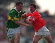18 June 2000; Don Davis of Cork in action against Killian Burns of Kerry during the Bank of Ireland Munster Senior Football Championship Semi-Final match between Kerry and Cork at Fitzgerald Stadium in Killarney, Kerry. Photo by Brendan Moran/Sportsfile