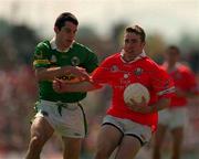 18 June 2000; Eoin Sexton of Cork in action against Aodan MacGearailt of Kerry during the Bank of Ireland Munster Senior Football Championship Semi-Final match between Kerry and Cork at Fitzgerald Stadium in Killarney, Kerry. Photo by Brendan Moran/Sportsfile