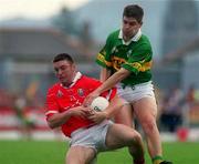 18 June 2000; Joe Kavanagh of Cork in action against Eamonn Fitzmaurice of Kerry during the Bank of Ireland Munster Senior Football Championship Semi-Final match between Kerry and Cork at Fitzgerald Stadium in Killarney, Kerry. Photo by Damien Eagers/Sportsfile
