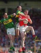 18 June 2000; Nicholas Murphy of Cork in action against Darragh Ó Sé, left, and Donal Daly of Kerry during the Bank of Ireland Munster Senior Football Championship Semi-Final match between Kerry and Cork at Fitzgerald Stadium in Killarney, Kerry. Photo by Damien Eagers/Sportsfile
