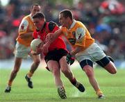 28 May 2000; Liam Doyle of Down in action against John Kelly of Antrim during the Bank of Ireland Ulster Senior Football Championship Quarter-Final match between Antrim and Down at Casement Park in Belfast, Antrim. Photo by David Maher/Sportsfile