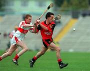 11 June 2000; Martin Coulter of Down in action against Gary Biggs of Derry during the Guinness Ulster Senior Hurling Championship Semi-Final match between Derry and Down at Casement Park in Belfast. Photo by Aoife Rice/Sportsfile
