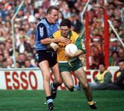 20 September 1992; Martin McHugh of Donegal is tackled by Keith Barr of Dublin during the All-Ireland Senior Football Championship Final between Donegal and Dublin at Croke Park in Dublin. Photo by David Maher/Sportsfile