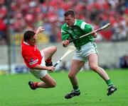 4 June 2000; Mark Foley of Limerick in action against Michael O'Connell, Cork during the Guinness Munster Senior Hurling Championship Semi-Final match between Cork and Limerick at Semple Stadium in Thurles, Tipperary. Photo by Ray McManus/Sportsfile