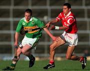27 May 2000; Michael O'Regan of Kerry in action against Seán Óg Ó hAilpín of Cork during the Guinness Munster Senior Hurling Championship Quarter-Final match between Kerry and Cork at Fitzgerald Stadium in Killarney, Kerry. Photo by Ray Lohan/Sportsfile