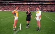 4 June 2000; Referee Michael Collins, Cork, tosses the coin between Offaly captain Sean Grennan and Meath captain Darren Fay prior to the Bank of Ireland Leinster Senior Football Championship Quarter-Final match between Offaly and Meath at Croke Park in Dublin. Photo by Damien Eagers/Sportsfile