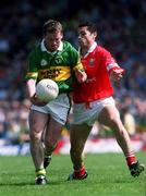 18 June 2000; Dara Ó Cinnéide of Kerry in action against Seán Óg Ó hAilpín of Cork during the Bank of Ireland Munster Senior Football Championship Semi-Final match between Kerry and Cork at Fitzgerald Stadium in Killarney, Kerry. Photo by Damien Eagers/Sportsfile
