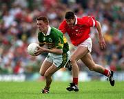 18 June 2000; Noel Kennelly of Kerry in action against Bernard Collins of Cork during the Bank of Ireland Munster Senior Football Championship Semi-Final match between Kerry and Cork at Fitzgerald Stadium in Killarney, Kerry. Photo by Brendan Moran/Sportsfile