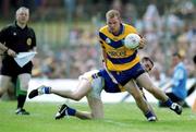 25 June 2000; Dessie Molohan of Clare avoids the challenge of Tipperary's Sean Maher during the Bank of Ireland Munster Senior Football Championship Semi-Final match between Clare and Tipperary at the Gaelic Grounds in Limerick. Photo by Brendan Moran/Sportsfile