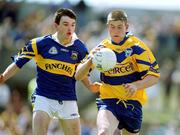 25 June 2000; David Russell of Clare gets away from the challenge of Dan Hackett of Tipperary during the Bank of Ireland Munster Senior Football Championship Semi-Final match between Clare and Tipperary at the Gaelic Grounds in Limerick. Photo by Brendan Moran/Sportsfile