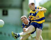 25 June 2000; Donal O'Sullivan of Clare gets his shot in despite the challenge of Eamon Hanrahan of Tipperary during the Bank of Ireland Munster Senior Football Championship Semi-Final match between Clare and Tipperary at the Gaelic Grounds in Limerick. Photo by Brendan Moran/Sportsfile
