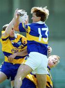 25 June 2000; Peter Lambert of Tipperary in action against Denis O'Driscoll, left, and Ronan Slattery of Clare during the Bank of Ireland Munster Senior Football Championship Semi-Final match between Clare and Tipperary at the Gaelic Grounds in Limerick. Photo by Brendan Moran/Sportsfile