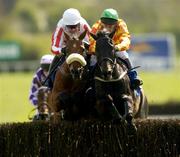 27 April 2004; Eventual winner Hi Cloy, left, with Timmy Murphy up, jumps the last with Lord Sam, with Jim Culloty up, on their way to winning the Ellier Developments Novice Steeplechase at Punchestown Racecourse in Kildare. Photo by Damien Eagers/Sportsfile