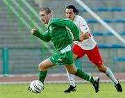 27 April 2004; Stephen Elliott of Republic of Ireland in action against Antoni Lukasiewicz of Poland during the U21 International Friendly match between Poland and Republic of Ireland at GKS Olimpa in Grudziadz, Poland. Photo by David Maher/Sportsfile