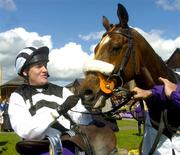 27 April 2004; Jockey Barry Geraghty with Moscow Flyer in the winners enclosure after winning the BETDAQ.com Champion Steeplechase at Punchestown Racecourse in Kildare. Photo by Damien Eagers/Sportsfile