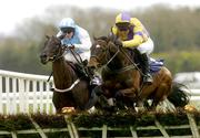 28 April 2004; Arch Stanton, with Ruby Walsh up, right, jumps the last ahead of eventual second place Hardy Duckett, with Pat Flood up, on the way to winning the Tattersalls Novice Hurdle at Punchestown Racecourse in Kildare. Photo by Matt Browne/Sportsfile