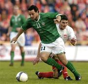 28 April 2004; Andy Reid of Republic of Ireland in action against Jacek Krzynowek of Poland during the International Friendly match between Poland and Republic of Ireland at the WKS Zawisza Stadium in Bydgoszcz, Poland. Photo by David Maher/Sportsfile