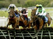 29 April 2004; Cherub, with Tony Dobbin up, right, jumps the last on the way to winning the Colm McEvoy Auctioneers Champion Four Year Old Hurdle, alongside second place Made In Japan, with Richard Johnson, left, at Punchestown Racecourse in Kildare. Photo by Matt Browne/Sportsfile