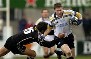 30 April 2004; Gordon D'Arcy of Leinster is tackled by Gavin Henson of Neath Swansea Ospreys during the Celtic League match between Leinster and Neath Swansea Ospreys at Donnybrook in Dublin. Photo by Pat Murphy/Sportsfile
