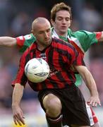 30 April 2004; Tony Grant of Bohemians in action against Cillian Lordan of Cork City during the Eircom League Premier Division match between Bohemians and Cork City at Dalymount Park in Dublin. Photo by Damien Eagers/Sportsfile
