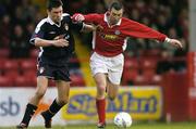 30 April 2004; Jason Byrne of Shelbourne in action against Darragh Maguire of St Patrick's Athletic during the Eircom League Premier Division match between Shelbourne and St Patrick's Athletic at Richmond Park in Dublin. Photo by David Maher/Sportsfile