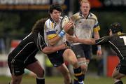 30 April 2004; Shane Horgan of Leinster is tackled by Adam Jones, left, and Richie Bater of Neath Swansea Ospreys during the Celtic League match between Leinster and Neath Swansea Ospreys at Donnybrook in Dublin. Photo by Pat Murphy/Sportsfile