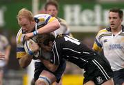 30 April 2004; Des Dillon of Leinster is tackled by Stefan Terblanche of Neath Swansea Ospreys during the Celtic League match between Leinster and Neath Swansea Ospreys at Donnybrook in Dublin. Photo by Pat Murphy/Sportsfile