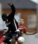 30 April 2004; Dave Rodgers of Shelbourne in action against Joseph Ndo of St Patrick's Athletic during the Eircom League Premier Division match between Shelbourne and St Patrick's Athletic at Richmond Park in Dublin. Photo by David Maher/Sportsfile