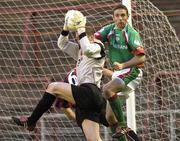 30 April 2004; Bohemians goalkeeper Seamus Kelly in action against Alan Bennett of Cork City during the Eircom League Premier Division match between Bohemians and Cork City at Dalymount Park in Dublin. Photo by Damien Eagers/Sportsfile