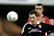 30 April 2004; Keith Dunne of St Patrick's Athletic in action against Ollie Cahill of Shelbourne during the Eircom League Premier Division match between Shelbourne and St Patrick's Athletic at Richmond Park in Dublin. Photo by David Maher/Sportsfile