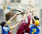2 May 2004; Westmeath's John Shaw, left, and and team-mate Daniel Carty in action against Wicklow's Graham Keogh, left, and Michael J O'Neill, 2, during the Guinness Leinster Senior Hurling Championship Preliminary Round match between Westmeath and Wicklow at Cusack Park in Mullingar, Westmeath. Photo by Pat Murphy/Sportsfile