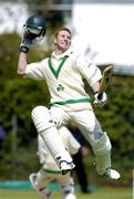 6 May 2004; Ireland batsman Andrew White celebrates after team-mate Kyle McCallan, not pictured, scored their winning run during the Cheltenham & Gloucester Trophy Second Round match between Ireland and Surrey at Clontarf Cricket Club in Castle Avenue, Dublin. Photo by Brian Lawless/Sportsfile