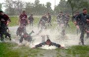 13 June 2000; Players dive in the water on the training pitch during an Ireland Rugby training session at Crusader Park in Oakville, Ontario, Canada. Photo by Matt Browne/Sportsfile