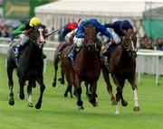 27 May 2000; Bachir, with Frankie Dettori up, centre, on their way to winning the Entenmann's Irish 2,000 Guineas from second place Giant's Causeway, with Mick Kinane up, right, and third place Cape Town, with Dane O'Neill up, left, at the Curragh Racecourse in Kildare. Photo by Sportsfile