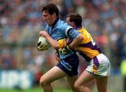 11 June 2000; Paddy Christie of Dublin in action against Colm Morris of Wexford during the Bank of Ireland Leinster Senior Football Championship Quarter-Final match between Dublin and Wexford at Croke Park in Dublin. Photo by Brendan Moran/Sportsfile