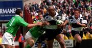 28 May 2000; Jonah Lomu of Barbarians is tackled by Jeremy Staunton, left and Kevin Maggs of Ireland during the Rugby International match between Ireland XV and Barbarians at Lansdowne Road in Dublin. Photo by Matt Browne/Sportsfile
