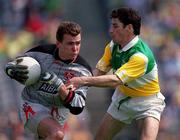 7 May 2000; Louth goalkeeper Colm Nally is tackled by Vinny Claffey of Offaly during the Church & General National Football League Division 2 Final between Louth and Offaly at Croke Park in Dublin. Photo by Ray McManus/Sportsfile