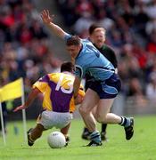 11 June 2000; Coman Goggins of Dublin in action against Scott Doran of Wexford during the Bank of Ireland Leinster Senior Football Championship Quarter-Final match between Dublin and Wexford at Croke Park in Dublin. Photo by Brendan Moran/Sportsfile