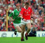 4 June 2000; Fergal McCormack of Cork in action against Ollie Moran of Limerick during the Guinness Munster Senior Hurling Championship Semi-Final match between Cork and Limerick at Semple Stadium in Thurles, Tipperary. Photo by Ray McManus/Sportsfile