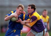 20 May 2000; Kevin O'Brien of Wicklow is tackled by Wexford's Colm Morris during the Bank of Ireland Leinster Senior Football Championship Group Stage Round 3 match between Wicklow and Wexford at Aughrim County Ground in Aughrim, Wicklow. Photo by Matt Browne/Sportsfile