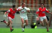 11 June 2000; Willie McCreery of Kildare in action against Peter McGinnity, left and Aidan O'Neill of Louth during the Bank of Ireland Leinster Senior Football Championship Quarter-Final match between Kildare and Louth at Croke Park in Dublin. Photo by Brendan Moran/Sportsfile